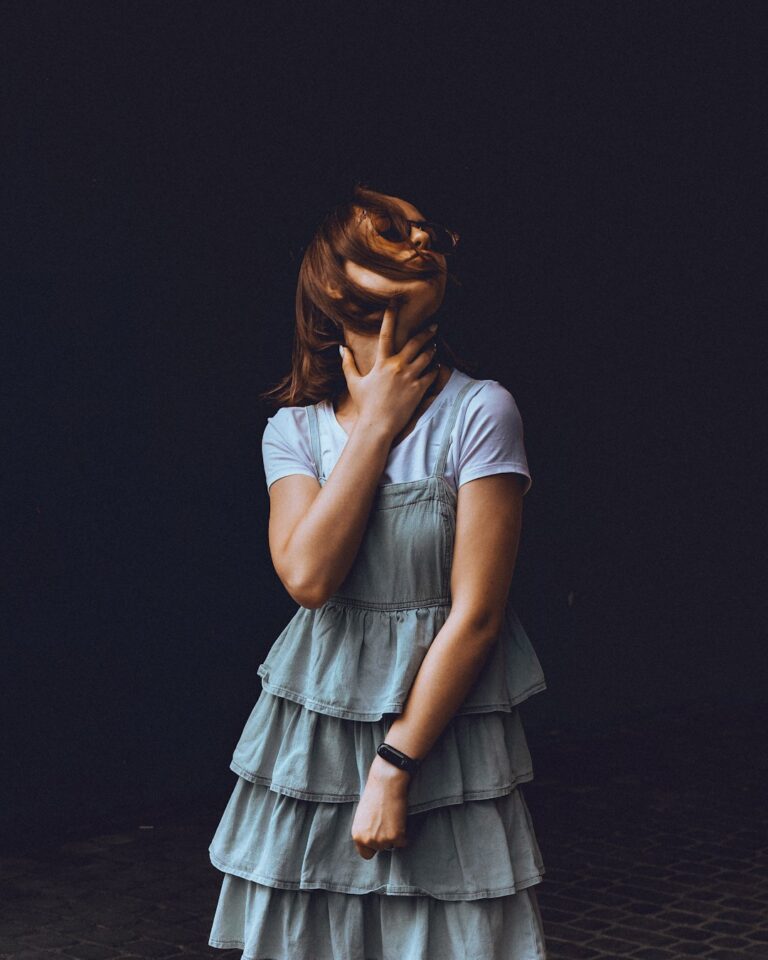 woman in blue dress on focus photography